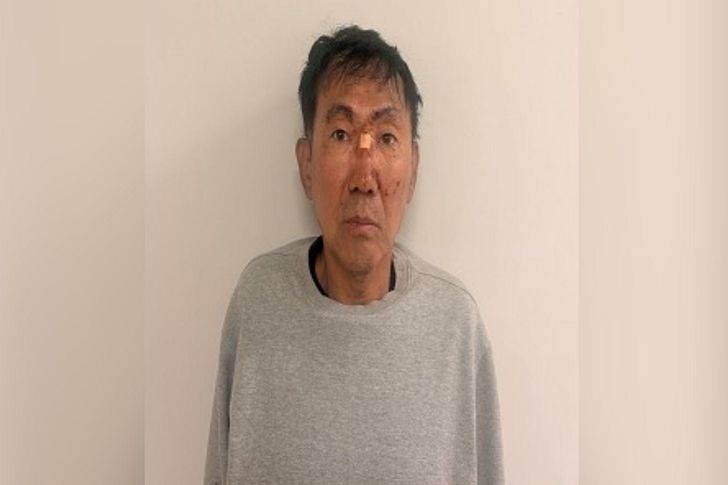 This photo, provided by the Incheon Metropolitan Police Agency, shows Choi Choong-rak, 59, who allegedly attempted to murder 10 people at a commercial complex in Incheon, just west of Seoul, Oct. 13, by wielding knives in both hands. The attack injured eight people, with one still unconscious after suffering cardiac arrest. Yonhap