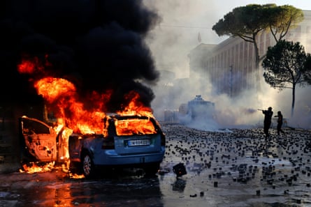 A car on fire during an anti-government demonstration outside the prime minister’s office in Tirana on Saturday.