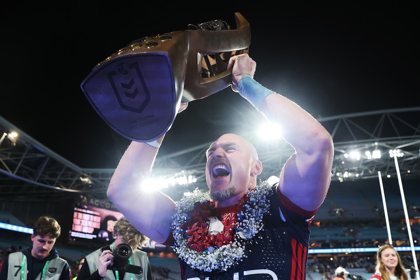 Angus Crichton roars as he lifts the premiership trophy
